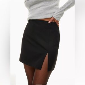 Aritzia black mini skirt with slit size 4